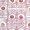 A light pink wallpaper with red and deeper pink accents, inspired by motifs on Middle Eastern ceramics.