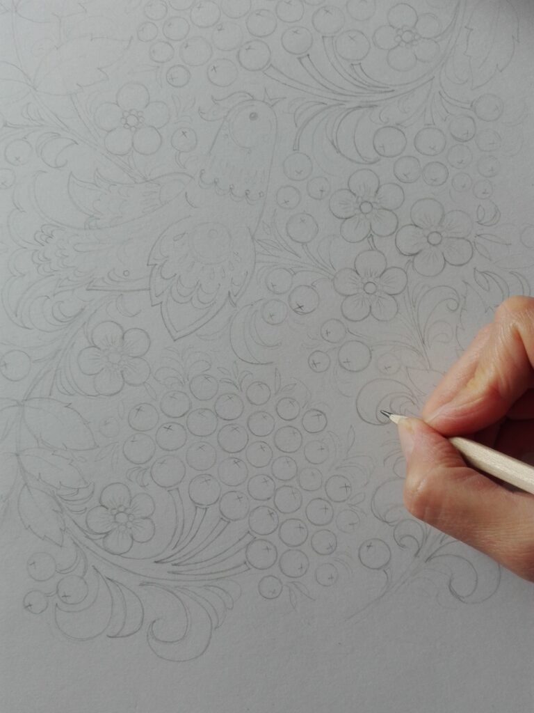 The founder of Olenka Design, Olga Shevchenko, working up her folk-inspired floral sketches.