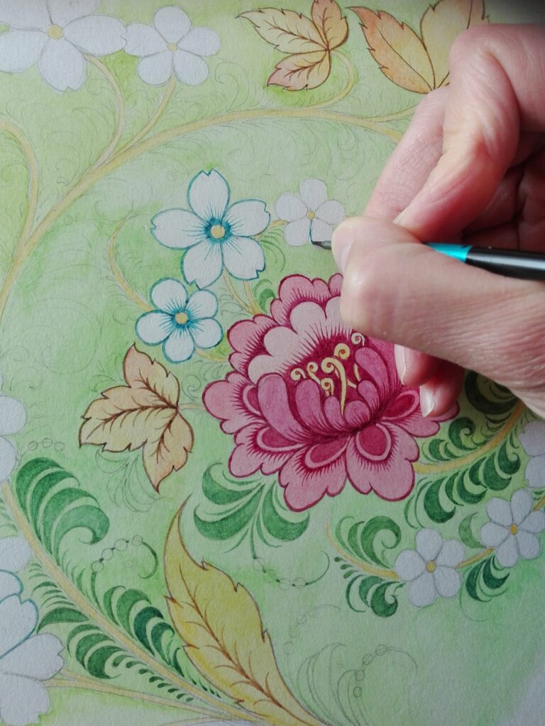 The founder of Olenka Design, Olga Shevchenko, working on her folk-inspired wallpapers.