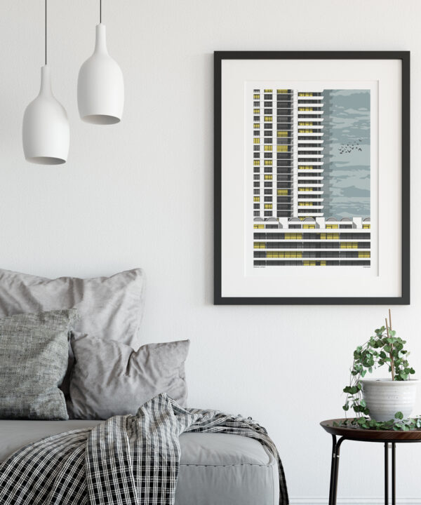 A print of a section of the Barbican in London in a sitting room scenario.