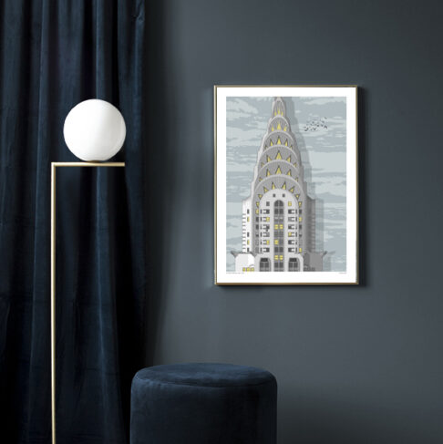 A print of a section of New York's Chrysler building in a sitting room scenario.