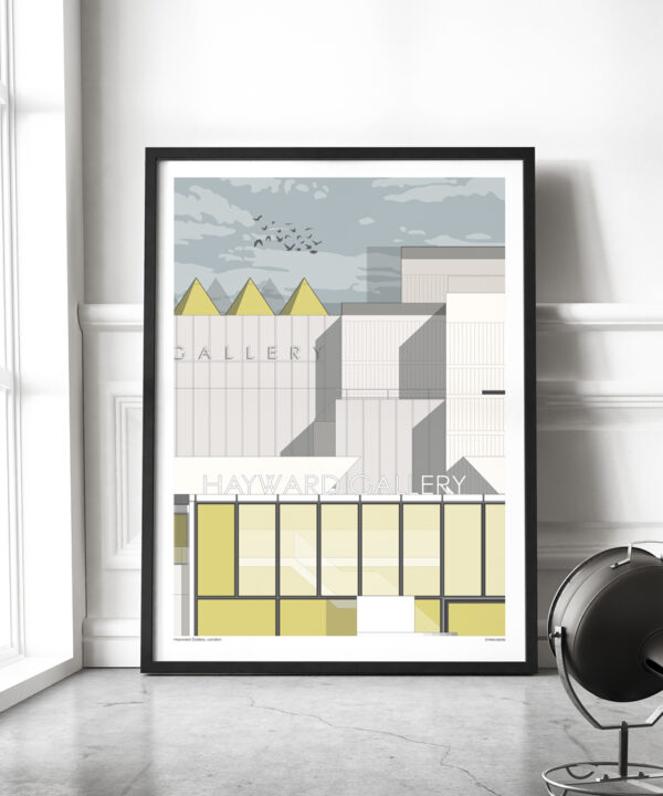 A large format, framed print of London's Hayward Gallery in a contemporary loft living space by a window.