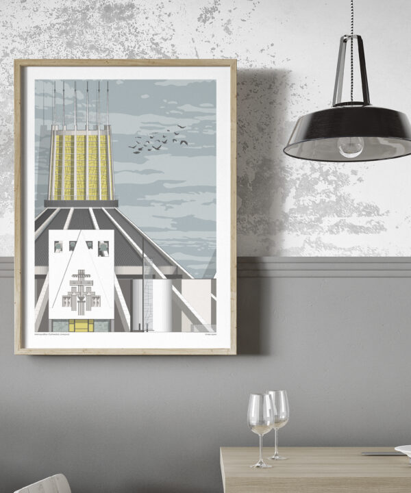 An art print of Liverpool Metropolitan Cathedral in a modern, grey dining space with an industrial pendant lamp.