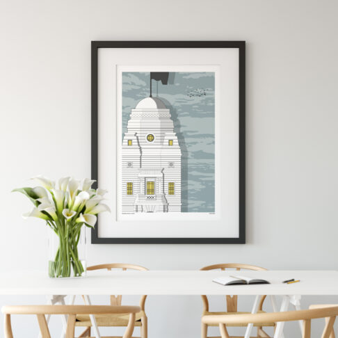 A print of the original Wembley stadium shown in a modern dining room setting.