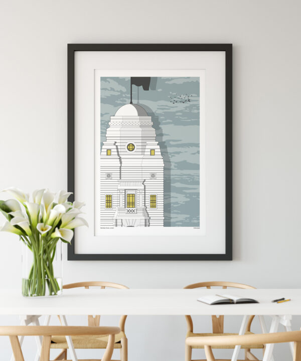 A print of the original Wembley stadium shown in a modern dining room setting.