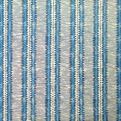 Striped blue and white wallpaper in a West-African-inspired, zig-zag design.