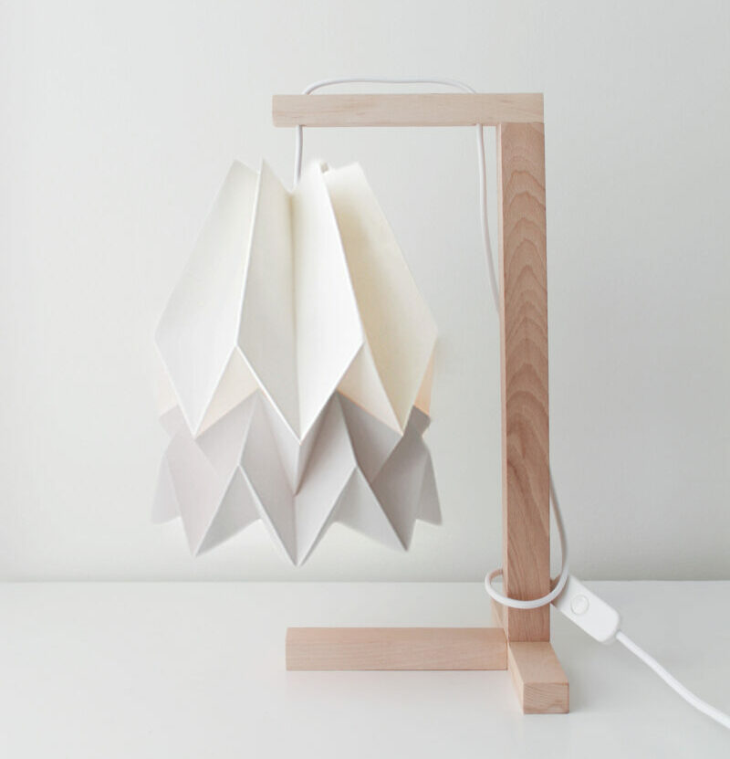 A Japanese-inspired origami hanging table lamp with wooden stand from Orikomi.