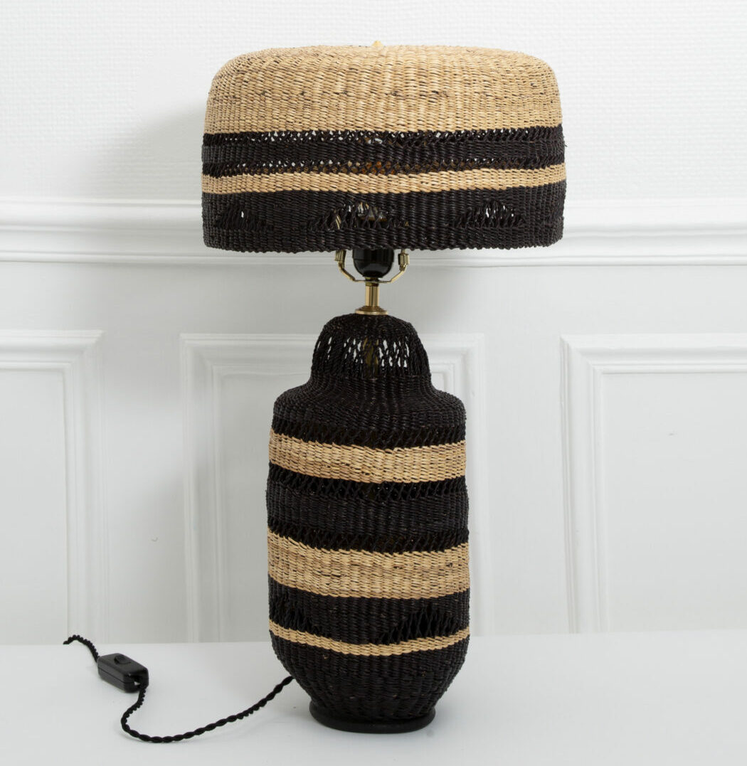 An unusual woven glass lamp and shade in black and natural from Hadeda.