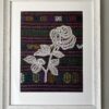 Unique framed wall art combining a hgandmade Slovenian bobbin lace rose against Thai silk.