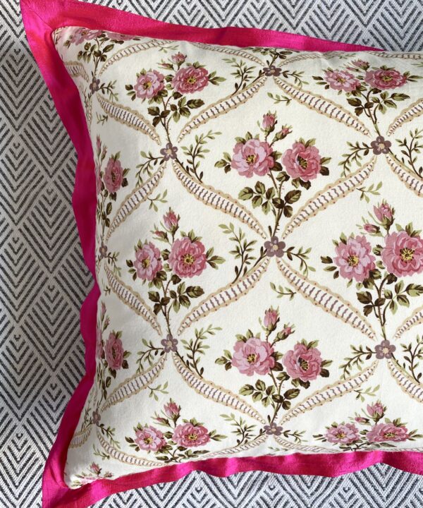 Vintage floral cushions with French-feel rosebud trellis design and hot pink, silk trim.