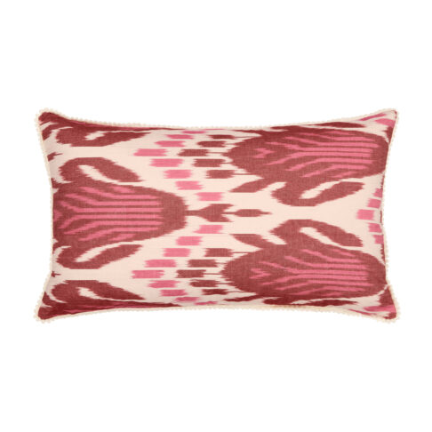 A burgundy and magenta rectangular cushion in silk Ikat with bobble trim.