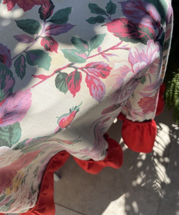 Detail of a pretty, floral, vintage tablecloth.