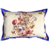 A vintage floral chintz cushion with a royal blue silk trim.