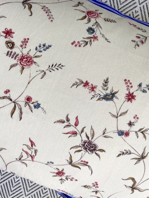 Floral sprig linen cushion detail.