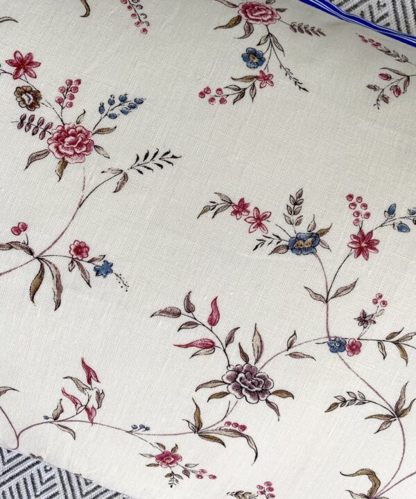 Floral sprig linen cushion detail.