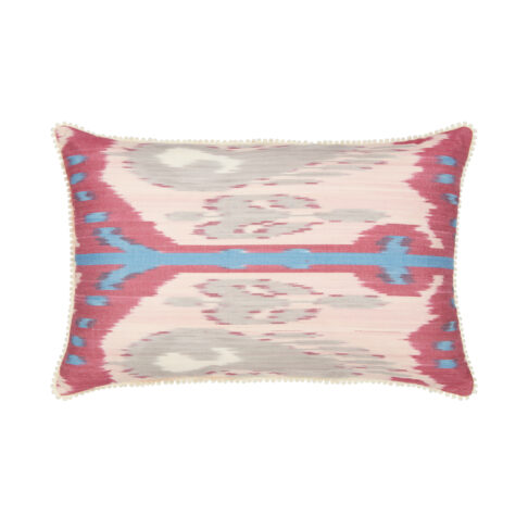 Rectangular silk Ikat cushion in deep pinks and blue with bobble trim.