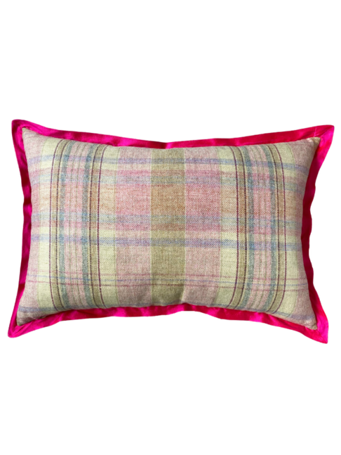 The pink check reverse of a rectangular cushion with a hot pink silk trim.