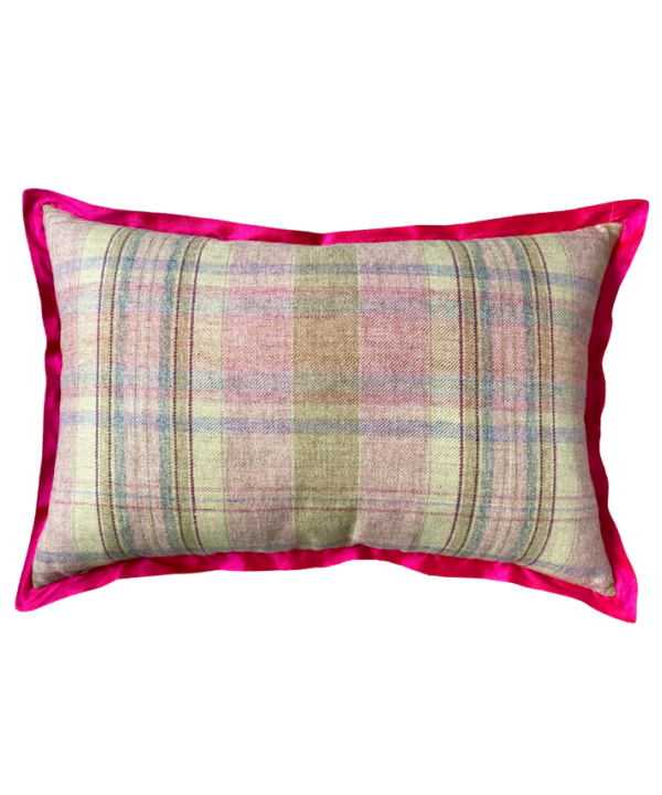 The pink check reverse of a rectangular cushion with a hot pink silk trim.