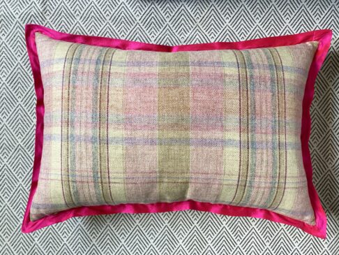 Rectangular cushion reverse in pink tartan with hot pink, silk trim.