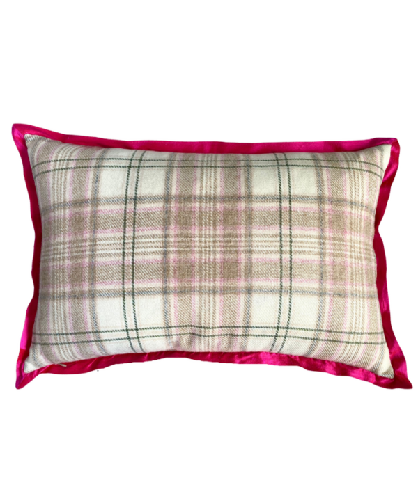 The pale cream and pink plaid reverse of a rectangular vintage floral cushion with a hot pink, silk trim.