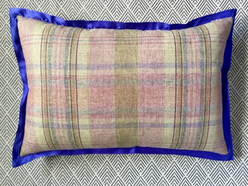 Pink check cushion reverse with blue silk trim.