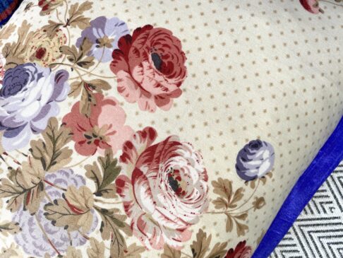 Detail of a vintage floral chintz cushion.