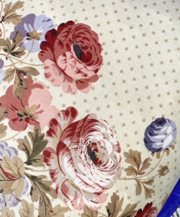 Detail of a vintage floral chintz cushion.