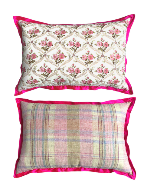 Vintage floral cushions in hot pink showing the rosebud trellis front and pink plaid reverse.