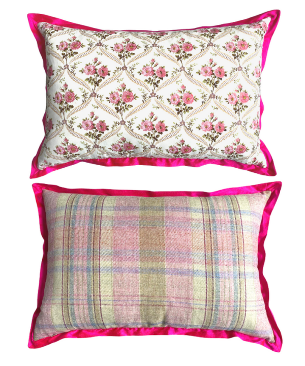 Vintage floral cushions in hot pink showing the rosebud trellis front and pink plaid reverse.