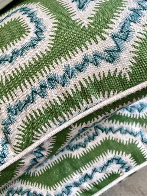 From our cushions and throws edit, 'Moorish Maze' cushions in green on hand-printed linen.