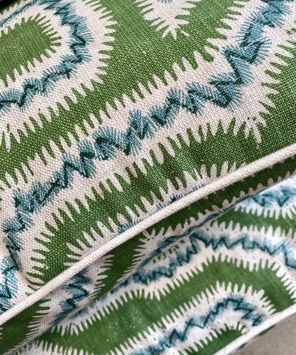 From our cushions and throws edit, 'Moorish Maze' cushions in green on hand-printed linen.