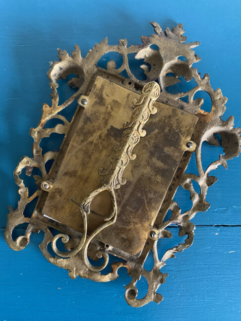 Reverse of a vintage brass photo frame sourced in a Spanish flea market.