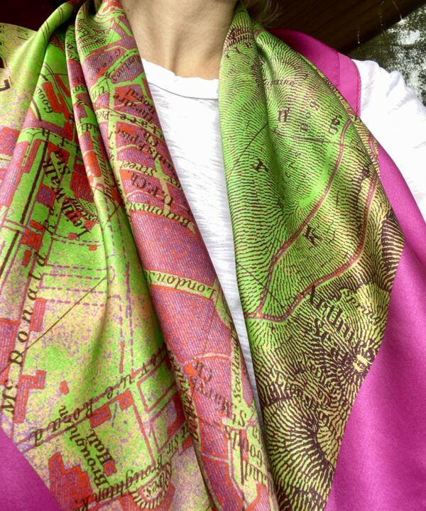 A model wearing with vintage Edinburgh map lime green and magenta pink silk scarf.