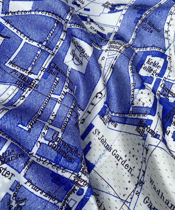 A blue and while luxury silk scarf showcasing a vintage map of Oxford, England.