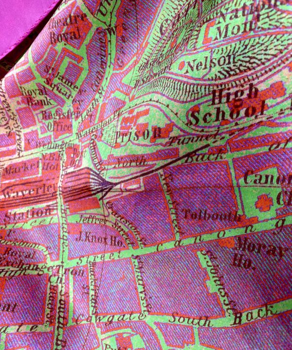 A pink and green luxury silk scarf depicting a vintage map of the city streets of Edinburgh, Scotland.