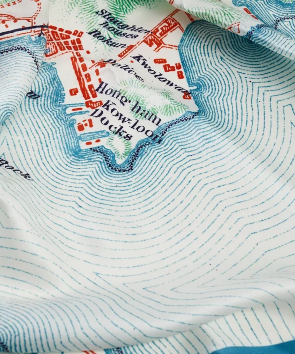 Detail of a luxury silk scarf depicting a map of Hong Kong.