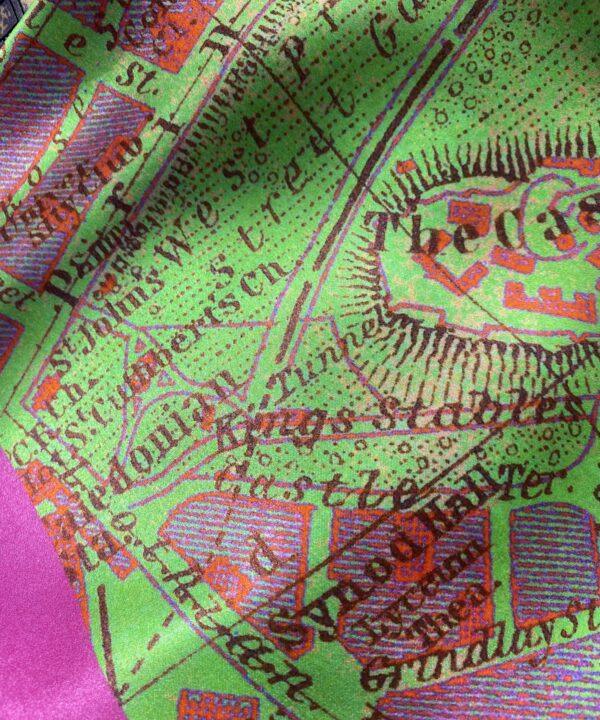 A magenta pink and lime green silk scarf printed with a vintage map of Edinburgh.