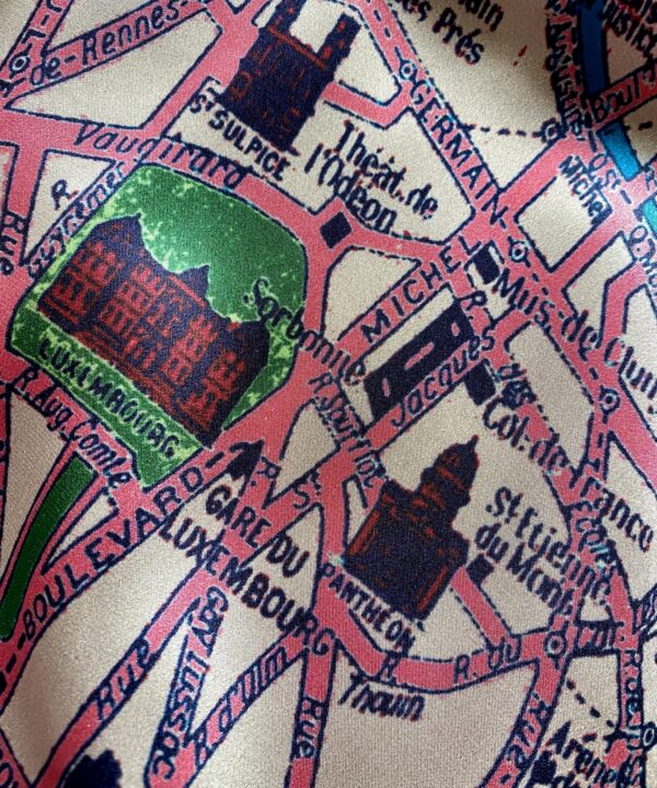 Detail of Paris streets on a silk scarf printed with a vintage map of the city.