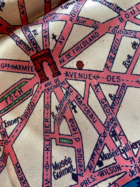 The Arc de Triomphe on a vintage map of Paris on a silk scarf.