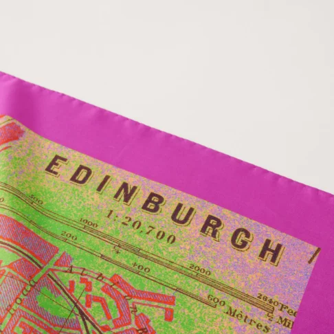 An Edinburgh map print luxury silk scarf in deep magenta pink and lime green.