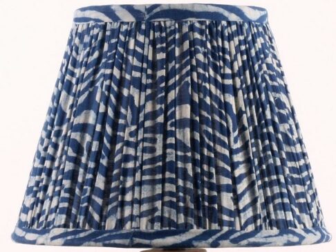 Indigo lampshade with block-print wave design.