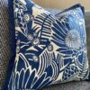 A blue floral cushion cover by Porcupine Rocks featuring a Protea print design.