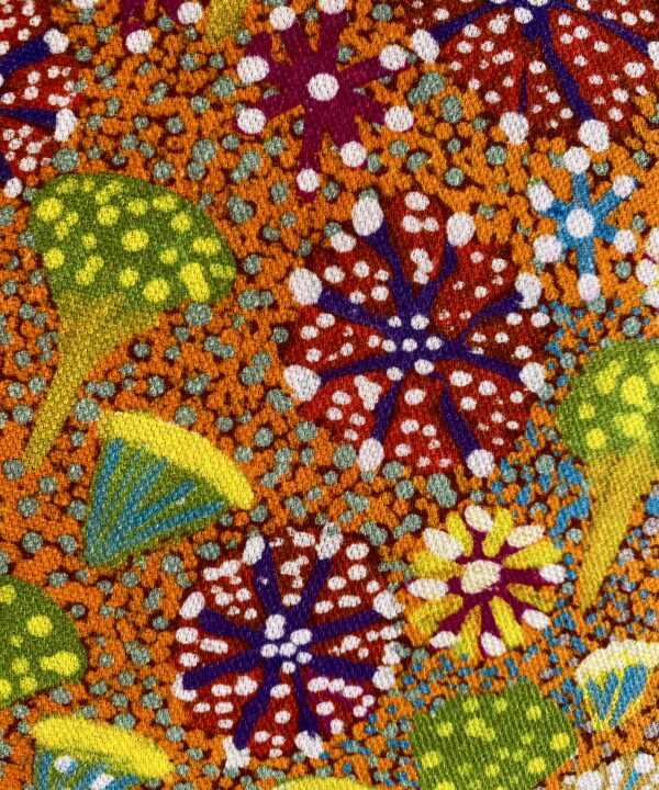 Brightly-coloured linen print of an original Aboriginal art canvas depicting a bush flora.