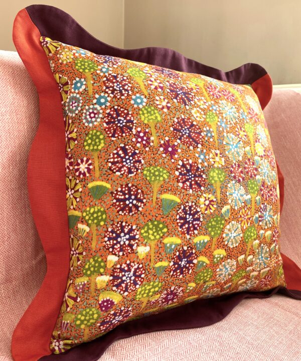 Colourful cushions in orange, burgundy, green and yellow with a botanical print on linen.