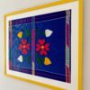 Framed Mexican colourful embroidery art textile with Sunshine yellow frame.