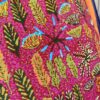 Close-up detail of a pink Aboriginal art linen fabric.