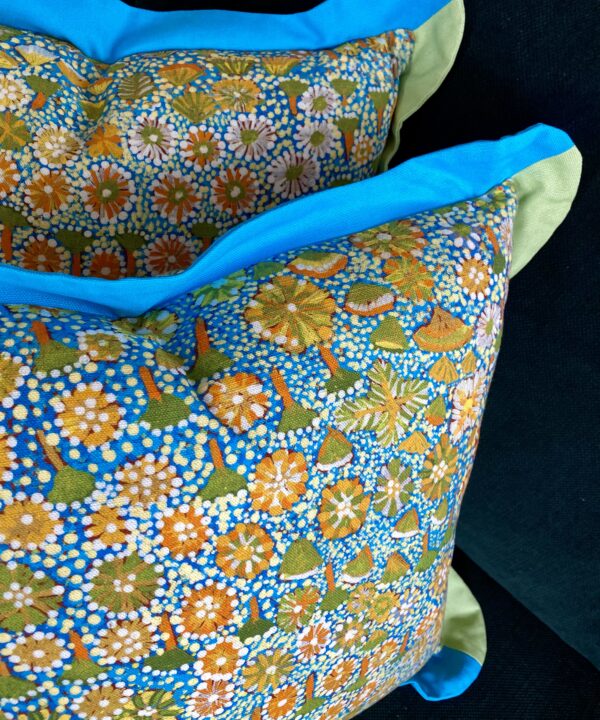 Botanical art print cushion bright turquoise, Spring greens and yellows.