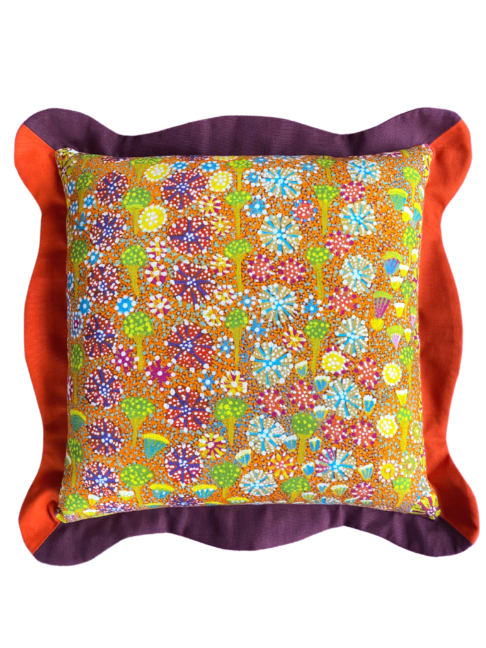 Colourful cushions in tropical colours depicting Aboriginal artwork on linen with scallop edge trims.