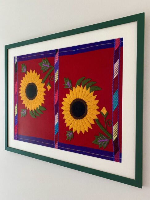 Sunflower framed wall art embroidered textile shot from the side.