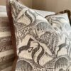 A Springbok print cushion design in monochrome depicting the African bush landscape.